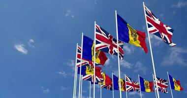 Moldova and United Kingdom Flags Waving Together in the Sky, Seamless Loop in Wind, Space on Left Side for Design or Information, 3D Rendering video