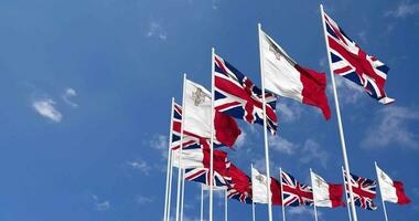 Malta and United Kingdom Flags Waving Together in the Sky, Seamless Loop in Wind, Space on Left Side for Design or Information, 3D Rendering video