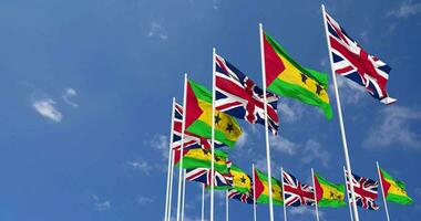 sao tome et principe et uni Royaume drapeaux agitant ensemble dans le ciel, sans couture boucle dans vent, espace sur la gauche côté pour conception ou information, 3d le rendu video