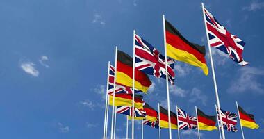 Germany and United Kingdom Flags Waving Together in the Sky, Seamless Loop in Wind, Space on Left Side for Design or Information, 3D Rendering video