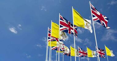 Vatican City and United Kingdom Flags Waving Together in the Sky, Seamless Loop in Wind, Space on Left Side for Design or Information, 3D Rendering video