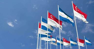 Nicaragua and Singapore Flags Waving Together in the Sky, Seamless Loop in Wind, Space on Left Side for Design or Information, 3D Rendering video