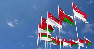 Oman and Singapore Flags Waving Together in the Sky, Seamless Loop in Wind, Space on Left Side for Design or Information, 3D Rendering video