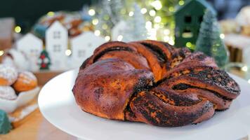 The Christmas bun on the Christmas table rotates on a 360 rotating platform. video