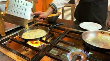 Fast food establishment. A very dirty kitchen where spaghetti is cooked on the stove. Cooking pasta in a dirty establishment video