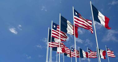 Liberia and France Flags Waving Together in the Sky, Seamless Loop in Wind, Space on Left Side for Design or Information, 3D Rendering video