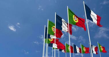 Portugal and France Flags Waving Together in the Sky, Seamless Loop in Wind, Space on Left Side for Design or Information, 3D Rendering video