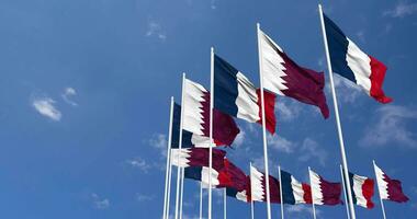 Qatar and France Flags Waving Together in the Sky, Seamless Loop in Wind, Space on Left Side for Design or Information, 3D Rendering video