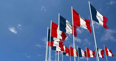 Peru and France Flags Waving Together in the Sky, Seamless Loop in Wind, Space on Left Side for Design or Information, 3D Rendering video