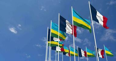 Rwanda and France Flags Waving Together in the Sky, Seamless Loop in Wind, Space on Left Side for Design or Information, 3D Rendering video
