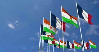 Niger and France Flags Waving Together in the Sky, Seamless Loop in Wind, Space on Left Side for Design or Information, 3D Rendering video