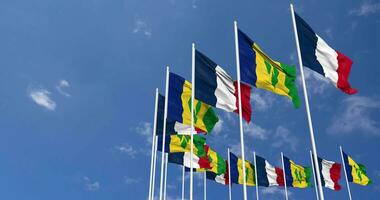 Saint Vincent and the Grenadines and France Flags Waving Together in the Sky, Seamless Loop in Wind, Space on Left Side for Design or Information, 3D Rendering video