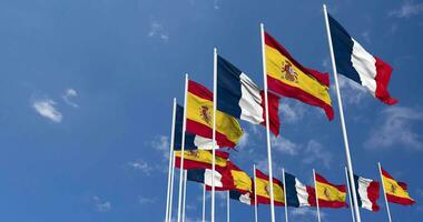 Spain and France Flags Waving Together in the Sky, Seamless Loop in Wind, Space on Left Side for Design or Information, 3D Rendering video