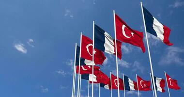 Turkey and France Flags Waving Together in the Sky, Seamless Loop in Wind, Space on Left Side for Design or Information, 3D Rendering video