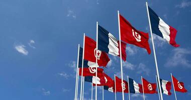 Tunisia and France Flags Waving Together in the Sky, Seamless Loop in Wind, Space on Left Side for Design or Information, 3D Rendering video