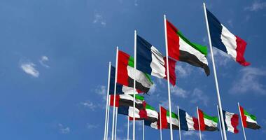 United Arab Emirates and France Flags Waving Together in the Sky, Seamless Loop in Wind, Space on Left Side for Design or Information, 3D Rendering video