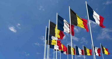 Belgium and France Flags Waving Together in the Sky, Seamless Loop in Wind, Space on Left Side for Design or Information, 3D Rendering video