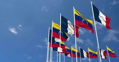 Bolivarian Republic of Venezuela and France Flags Waving Together in the Sky, Seamless Loop in Wind, Space on Left Side for Design or Information, 3D Rendering video