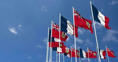 Bermuda and France Flags Waving Together in the Sky, Seamless Loop in Wind, Space on Left Side for Design or Information, 3D Rendering video