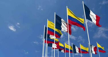 Colombia and France Flags Waving Together in the Sky, Seamless Loop in Wind, Space on Left Side for Design or Information, 3D Rendering video