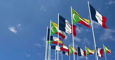 Comoros and France Flags Waving Together in the Sky, Seamless Loop in Wind, Space on Left Side for Design or Information, 3D Rendering video