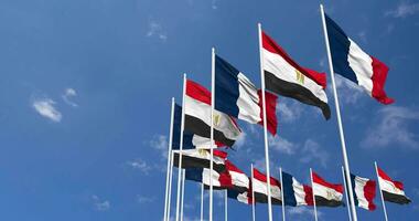 Egypt and France Flags Waving Together in the Sky, Seamless Loop in Wind, Space on Left Side for Design or Information, 3D Rendering video