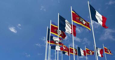 Eswatini and France Flags Waving Together in the Sky, Seamless Loop in Wind, Space on Left Side for Design or Information, 3D Rendering video