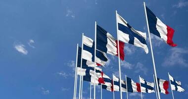 Finland and France Flags Waving Together in the Sky, Seamless Loop in Wind, Space on Left Side for Design or Information, 3D Rendering video