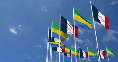 Gabon and France Flags Waving Together in the Sky, Seamless Loop in Wind, Space on Left Side for Design or Information, 3D Rendering video