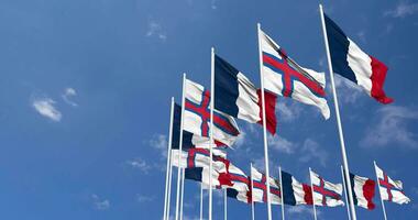 Faroe Islands and France Flags Waving Together in the Sky, Seamless Loop in Wind, Space on Left Side for Design or Information, 3D Rendering video