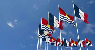 Kiribati and France Flags Waving Together in the Sky, Seamless Loop in Wind, Space on Left Side for Design or Information, 3D Rendering video