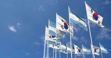 Argentina and South Korea Flags Waving Together in the Sky, Seamless Loop in Wind, Space on Left Side for Design or Information, 3D Rendering video