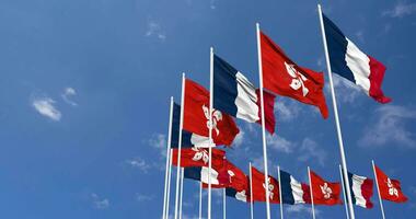 Hong Kong and France Flags Waving Together in the Sky, Seamless Loop in Wind, Space on Left Side for Design or Information, 3D Rendering video