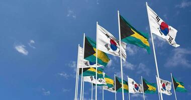 Bahamas and South Korea Flags Waving Together in the Sky, Seamless Loop in Wind, Space on Left Side for Design or Information, 3D Rendering video