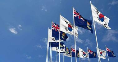 Cayman Islands and South Korea Flags Waving Together in the Sky, Seamless Loop in Wind, Space on Left Side for Design or Information, 3D Rendering video