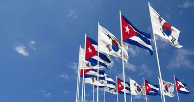 Cuba et Sud Corée drapeaux agitant ensemble dans le ciel, sans couture boucle dans vent, espace sur la gauche côté pour conception ou information, 3d le rendu video