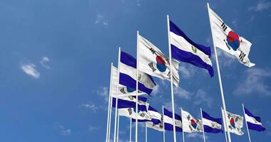 El Salvador and South Korea Flags Waving Together in the Sky, Seamless Loop in Wind, Space on Left Side for Design or Information, 3D Rendering video