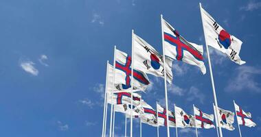 Faroe Islands and South Korea Flags Waving Together in the Sky, Seamless Loop in Wind, Space on Left Side for Design or Information, 3D Rendering video