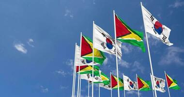 Guyana and South Korea Flags Waving Together in the Sky, Seamless Loop in Wind, Space on Left Side for Design or Information, 3D Rendering video