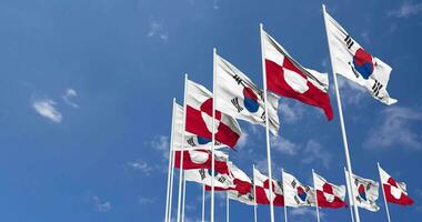 Greenland and South Korea Flags Waving Together in the Sky, Seamless Loop in Wind, Space on Left Side for Design or Information, 3D Rendering video