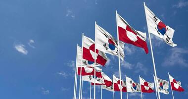 Greenland and South Korea Flags Waving Together in the Sky, Seamless Loop in Wind, Space on Left Side for Design or Information, 3D Rendering video