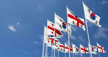 Georgia and South Korea Flags Waving Together in the Sky, Seamless Loop in Wind, Space on Left Side for Design or Information, 3D Rendering video