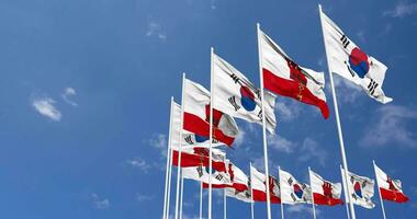 Gibraltar and South Korea Flags Waving Together in the Sky, Seamless Loop in Wind, Space on Left Side for Design or Information, 3D Rendering video