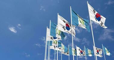 guatemala och söder korea flaggor vinka tillsammans i de himmel, sömlös slinga i vind, Plats på vänster sida för design eller information, 3d tolkning video