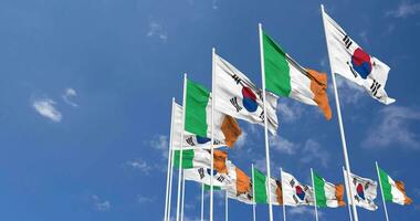 Ireland and South Korea Flags Waving Together in the Sky, Seamless Loop in Wind, Space on Left Side for Design or Information, 3D Rendering video