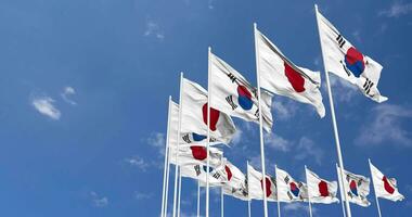 Japan and South Korea Flags Waving Together in the Sky, Seamless Loop in Wind, Space on Left Side for Design or Information, 3D Rendering video