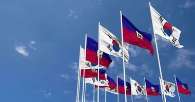 Haiti and South Korea Flags Waving Together in the Sky, Seamless Loop in Wind, Space on Left Side for Design or Information, 3D Rendering video
