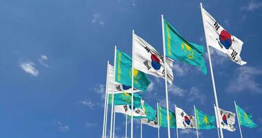 Kazakhstan and South Korea Flags Waving Together in the Sky, Seamless Loop in Wind, Space on Left Side for Design or Information, 3D Rendering video