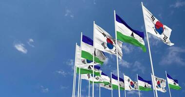 Lesotho and South Korea Flags Waving Together in the Sky, Seamless Loop in Wind, Space on Left Side for Design or Information, 3D Rendering video