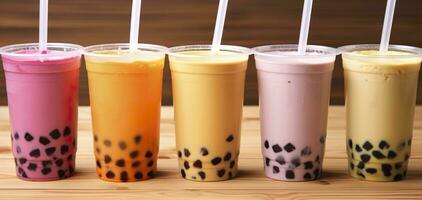 AI generated Plastic cups of different tasty bubble tea on wooden background. Generative AI photo
